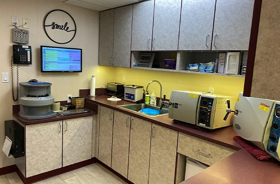 The sterilization area, with autoclaves under the practice's smile sign.